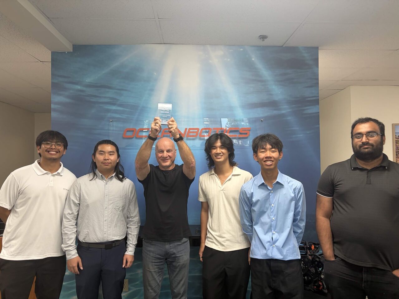 Robert Jechart and the ROV Titan ROV team celebrate their victiry at Oceanbotics HQ. 