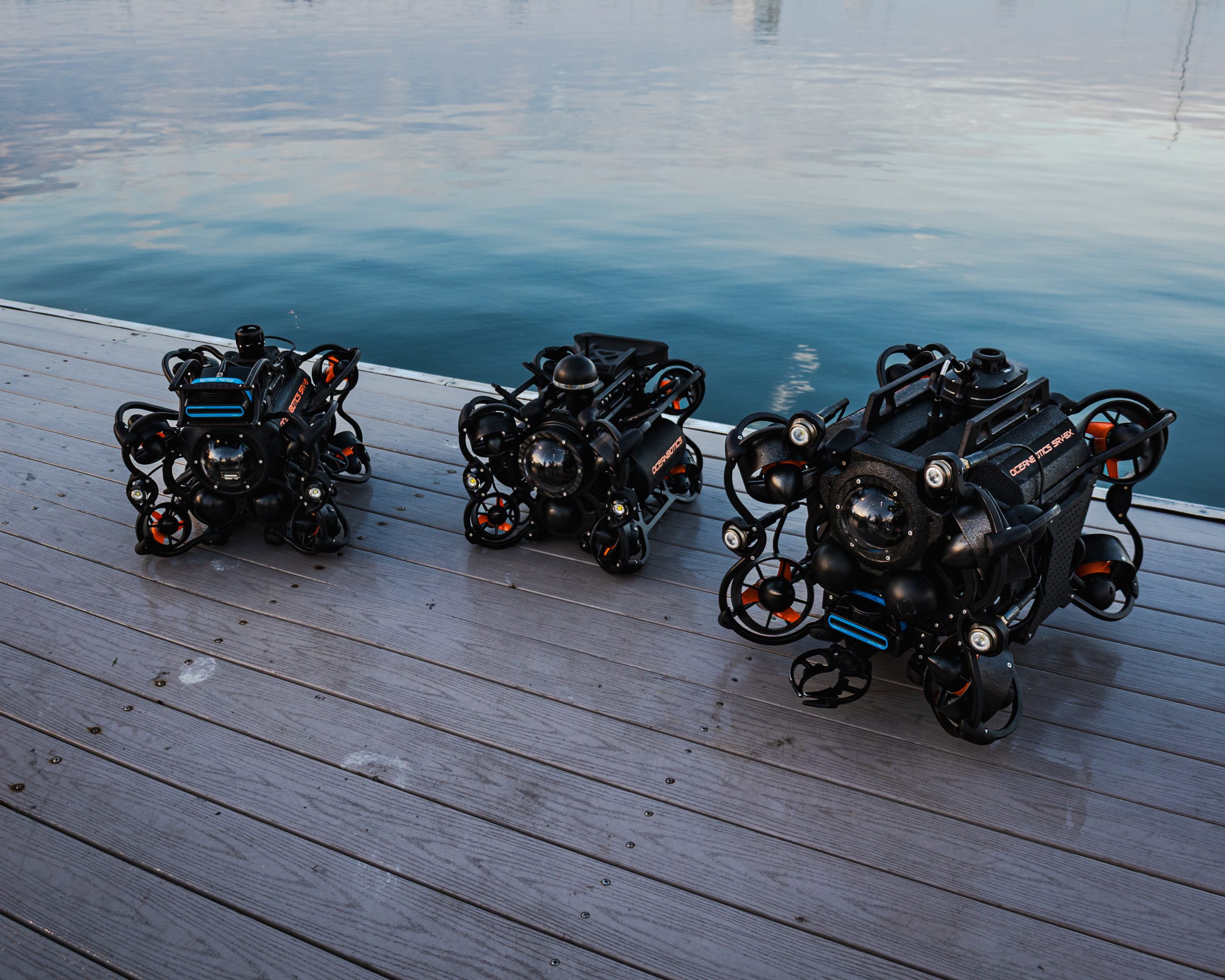 IMG_0753 Oceanbotics SRV-8 Series ROVs sitting on a dock. From left to right: SRV-8, SRV-8C, and SRV-8X for the ROV selection guide
